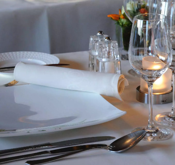 Set table with cutlery and glasses