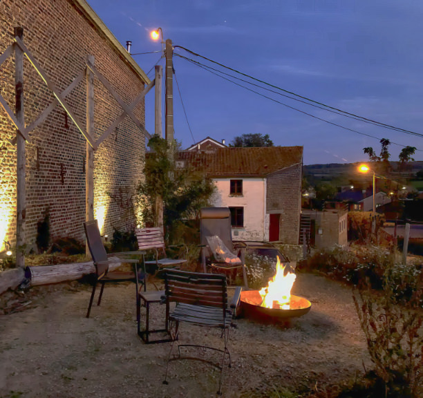 Outdoor patio with panorama at night with campfire